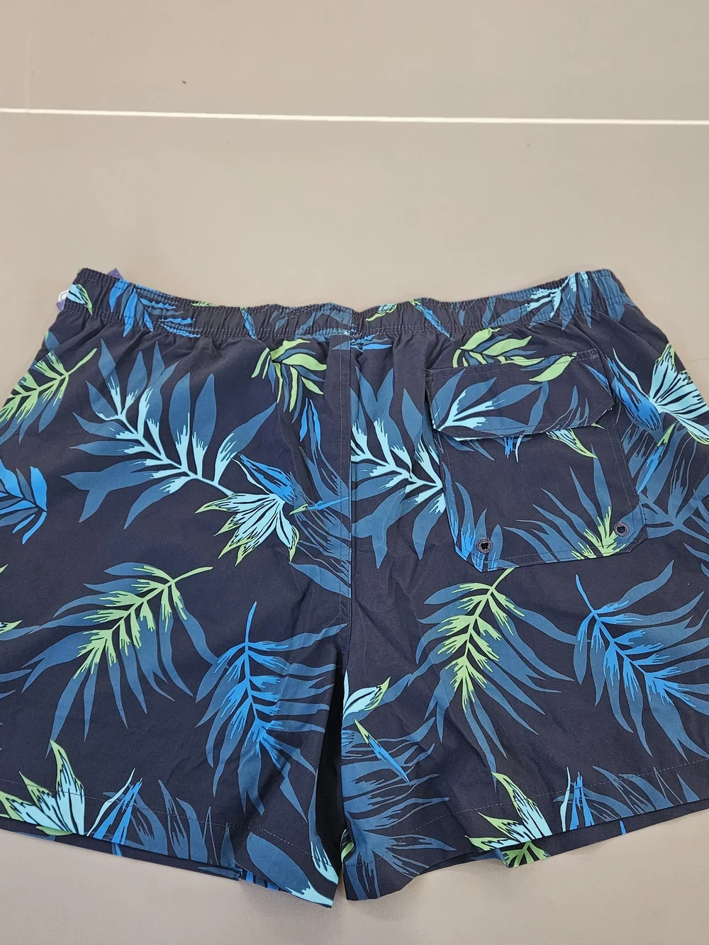 Kanu Surf Navy Swim Trunks with Blue & Green Tropical Leaves